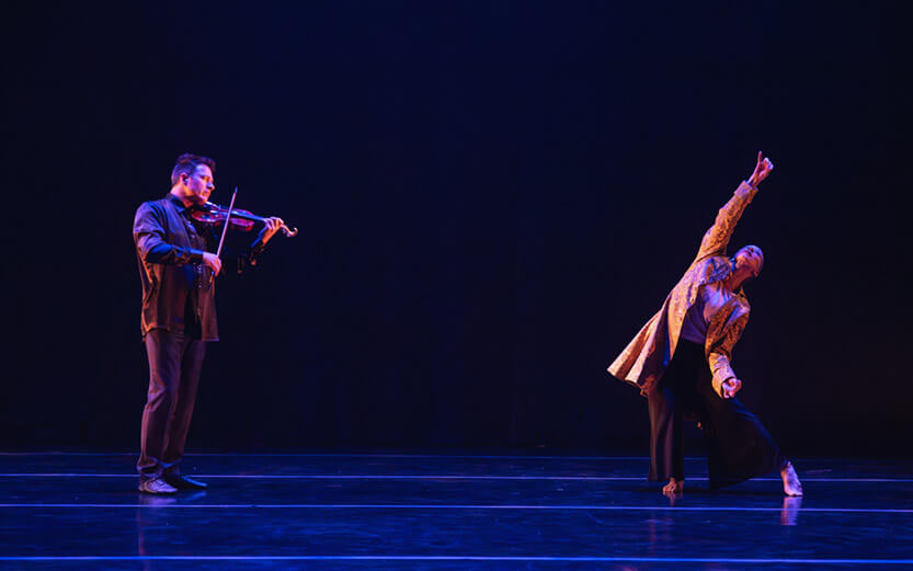 dancer on stage with violinist