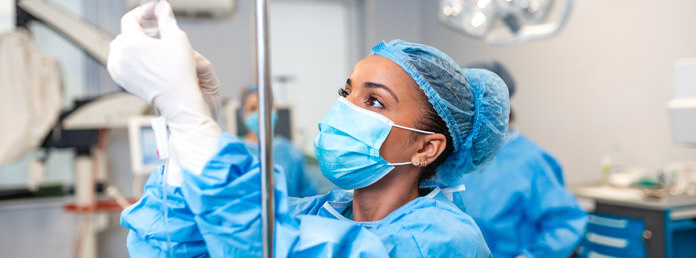a nurse hooking up an IV