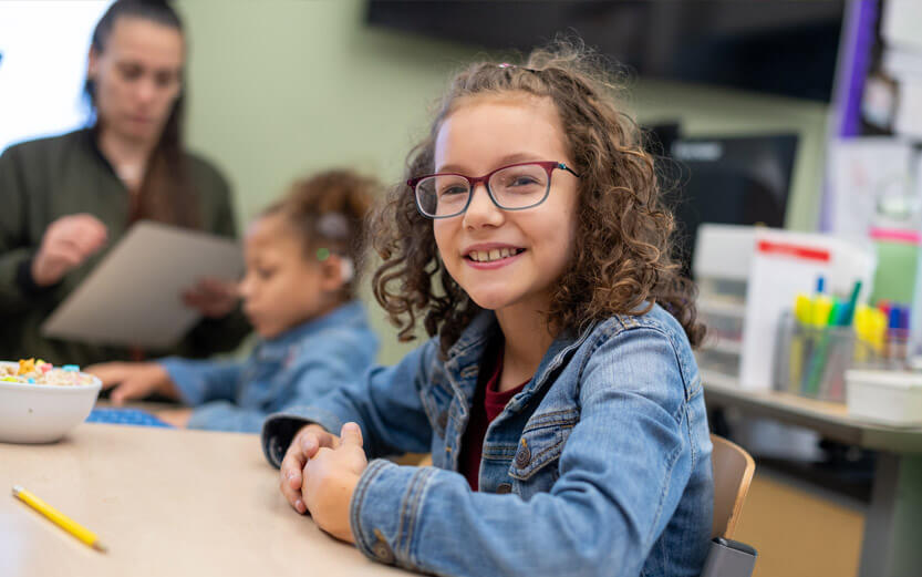ASD elementary school age student smiling
