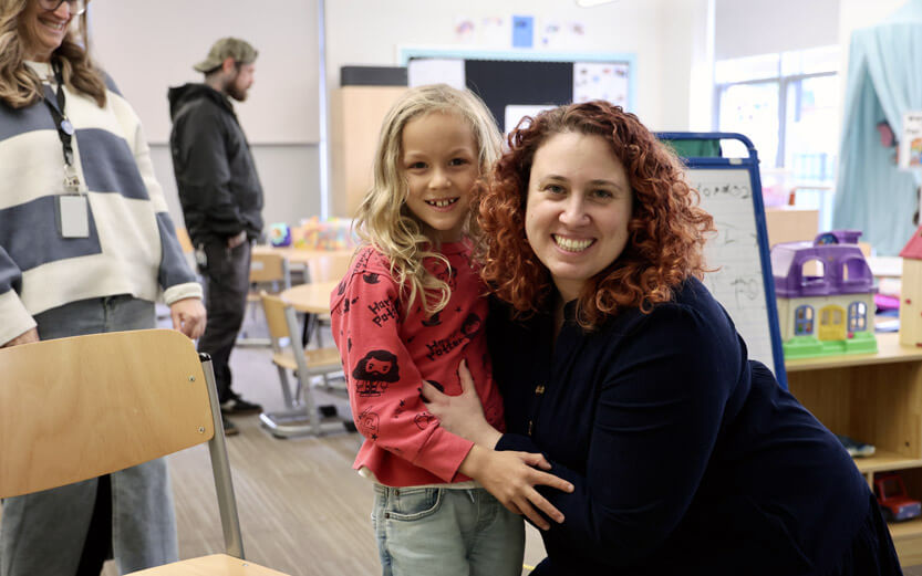 ASD teacher and student smiling