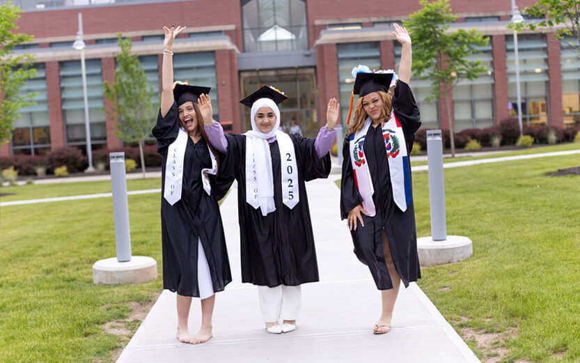 three ASD students at graduation