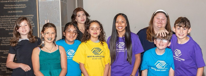 a group of teens wearing Boys & Girls Club tshirts
