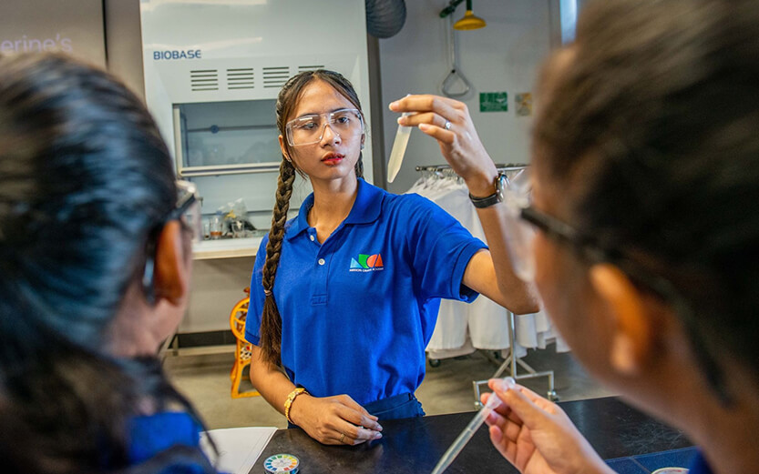 students engaged in a science experiment at the Neeson Cripps Academy