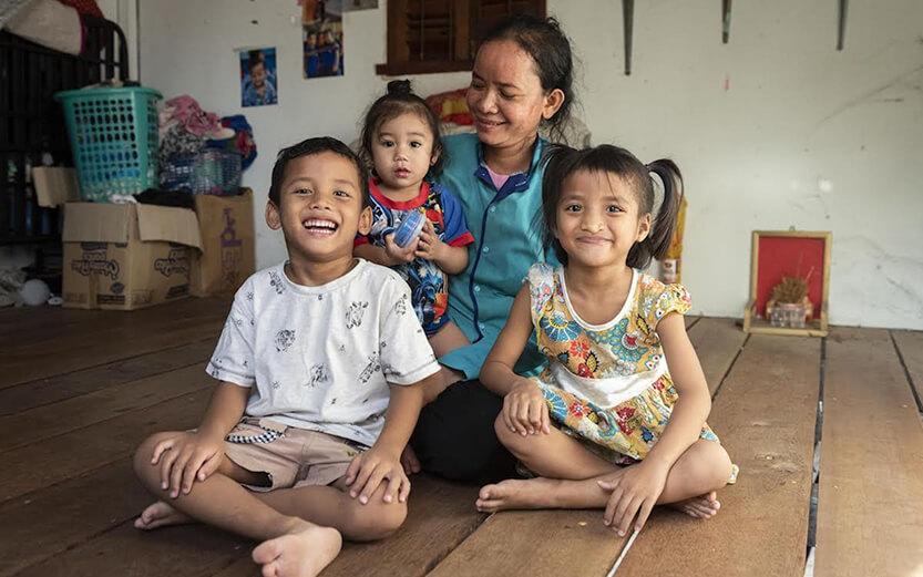 Mother with children sitting on the floor