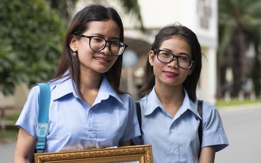 two university students smiling