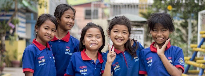 five young students smiling