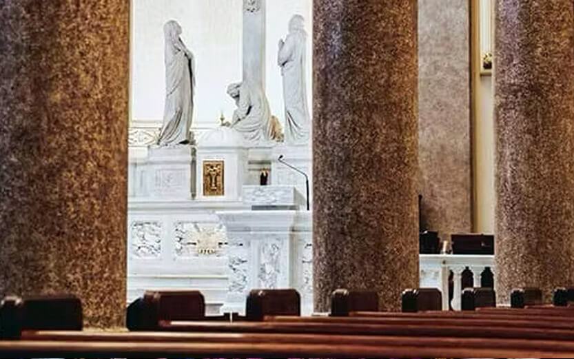 pews and statues in the church sanctuary