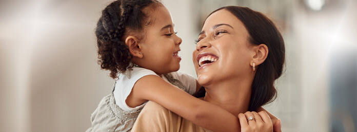 girl hugging mom