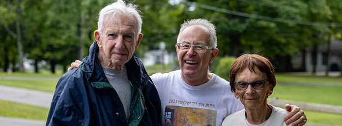 people posing for a picture outside
