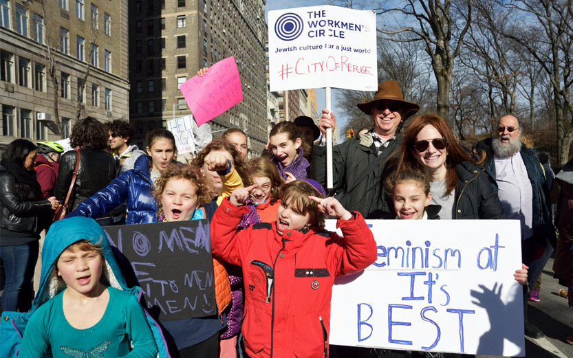 a group of adults and kids at a demonstration