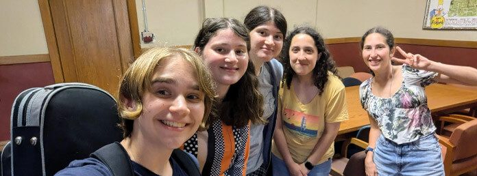 a group of teen girls smiling
