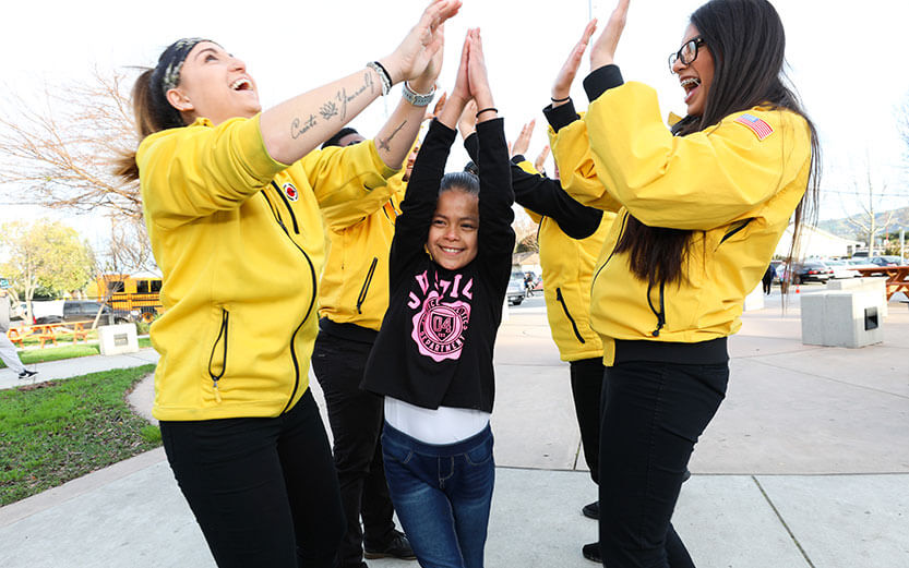Corps members having fun with students