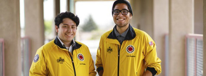 two City Year volunteers wearing yellow jacket