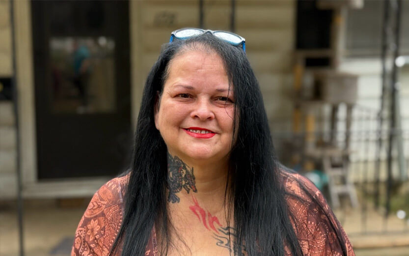a woman who has received help from CSH smiling