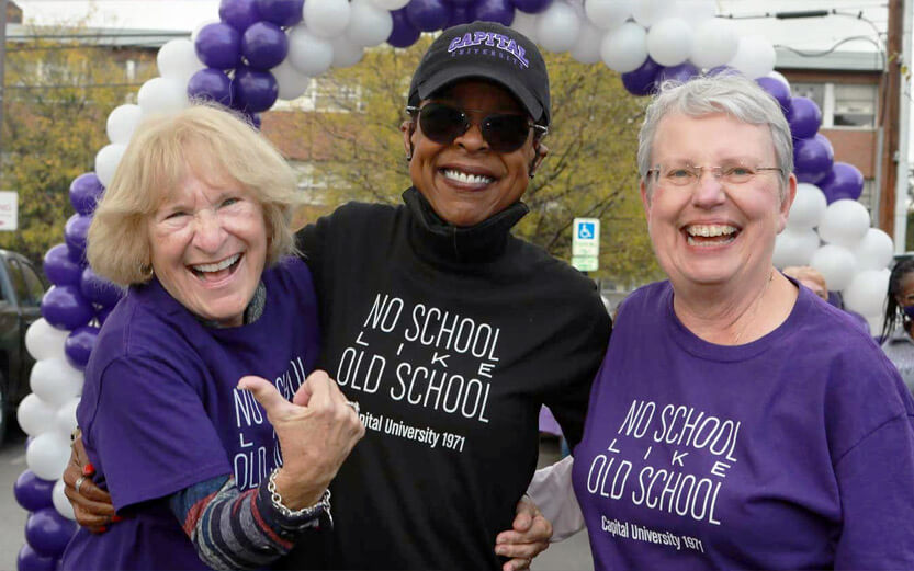 three women alumni wearing CU 1971 tshirts