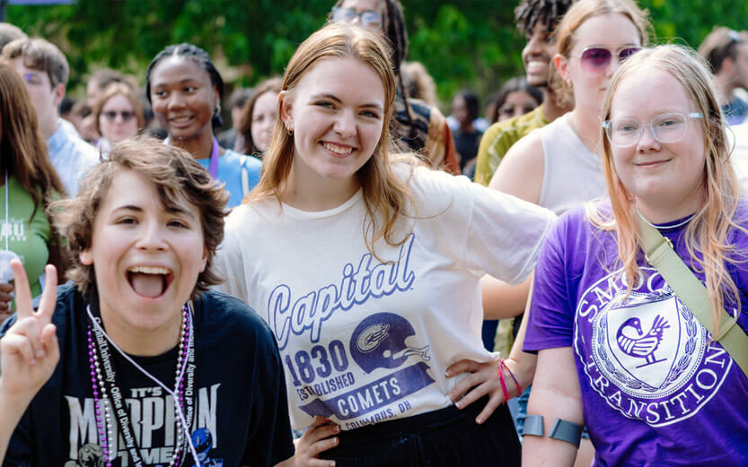 three female students wearing Capital tshirts