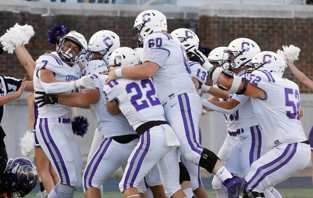 the school football team celebrating a touchdown