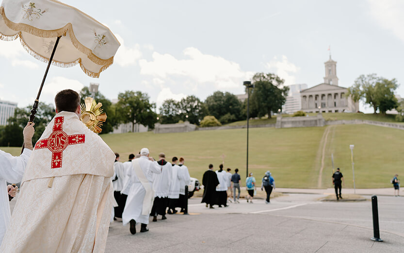 a Catholic Eucharistic procession passing near the Tennessee State Capitol in Nashville, Tennessee, during the National Eucharistic Pilgrimage