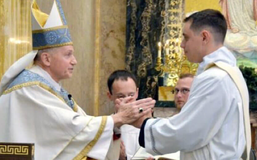 a priest giving his blessing