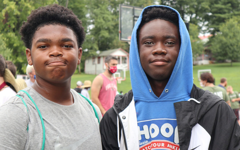 two teen boys smiling