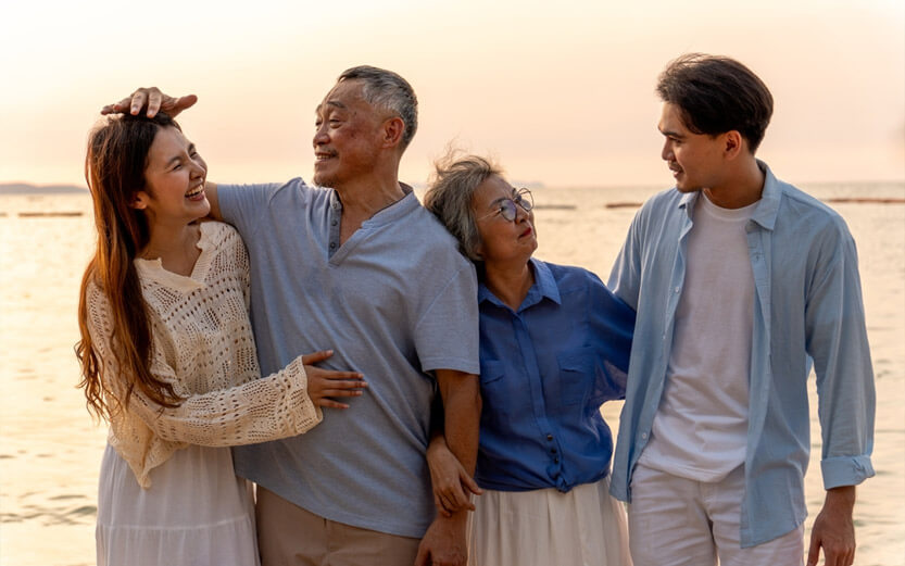 family at the beach at sunset