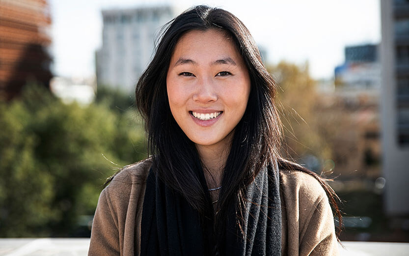 portrait of a happy young woman outdoor - Close up of a smiling asian girl in the city. High quality photo