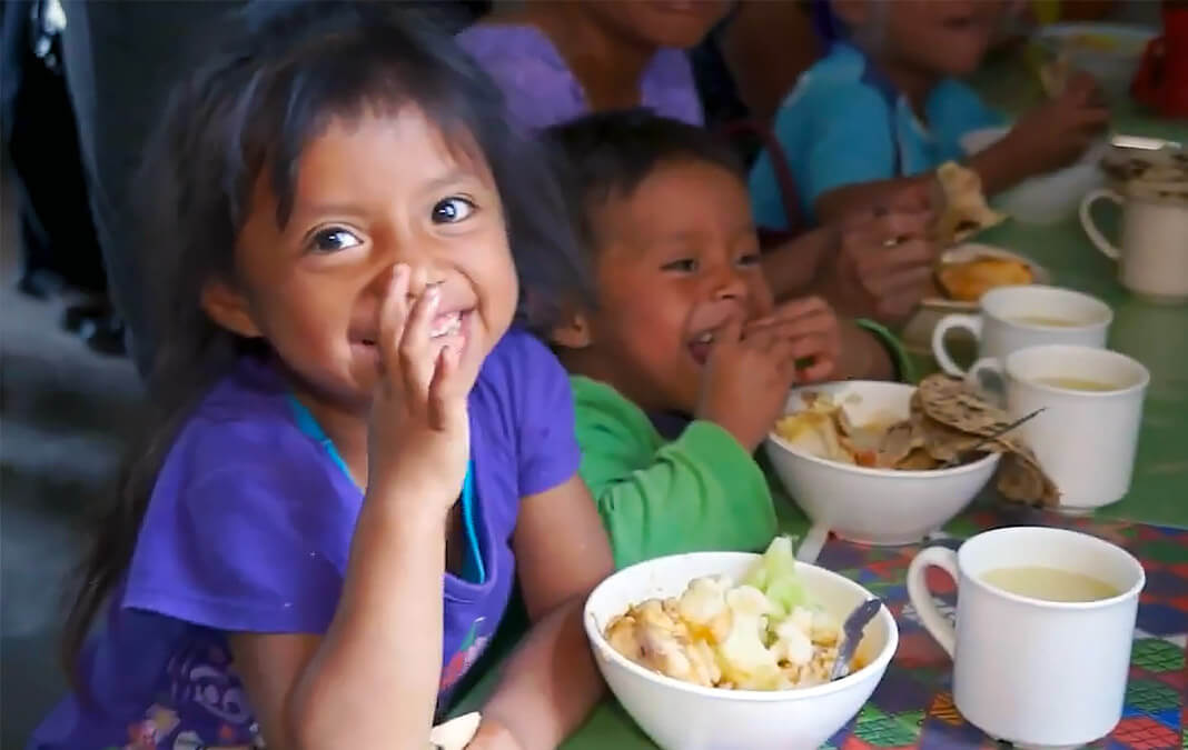 young children enjoying a healthy meal