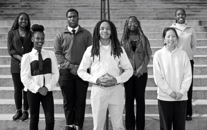 an organized shot of a group of teens with steps behind them
