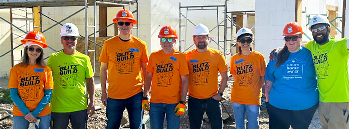 group of volunteers wearing bright colored shirts