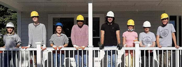 a group of students volunteer doing construction