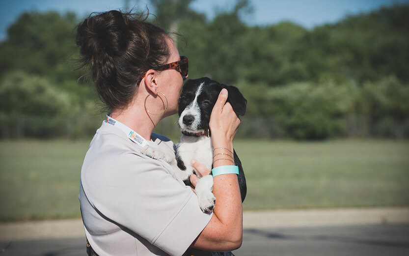 Woman holding a puppy