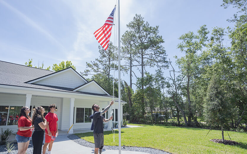 Man raising the American flag