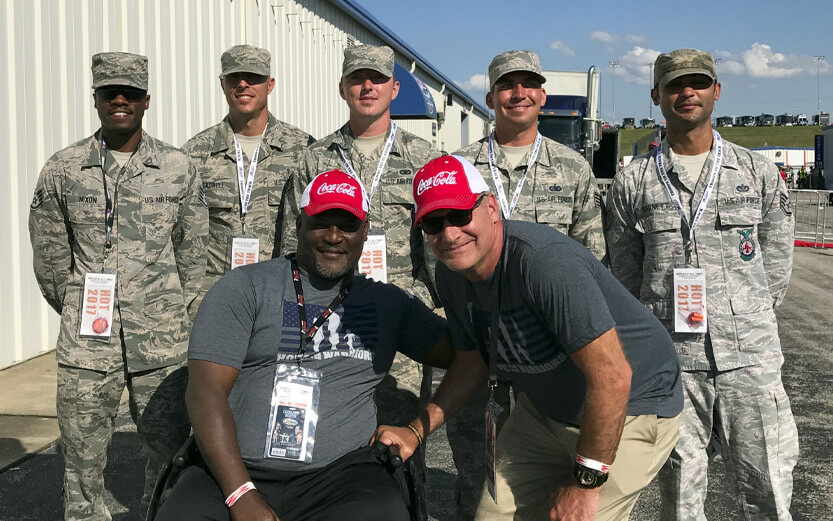 group of soldiers with veteran in wheelchair