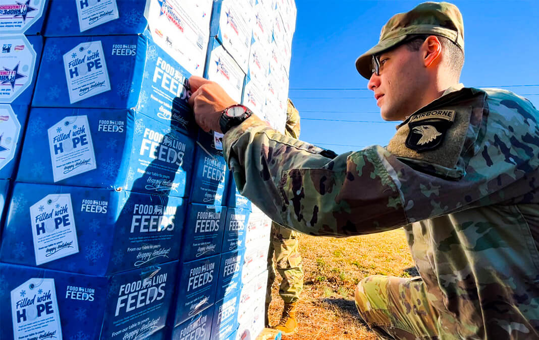 military labeling boxes of food supplies