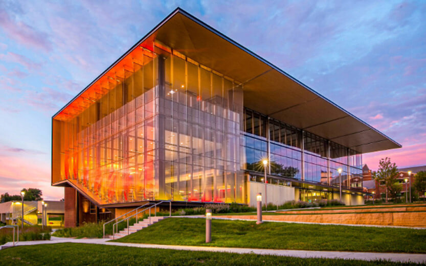 a beautiful shot of the KCU building at sunset
