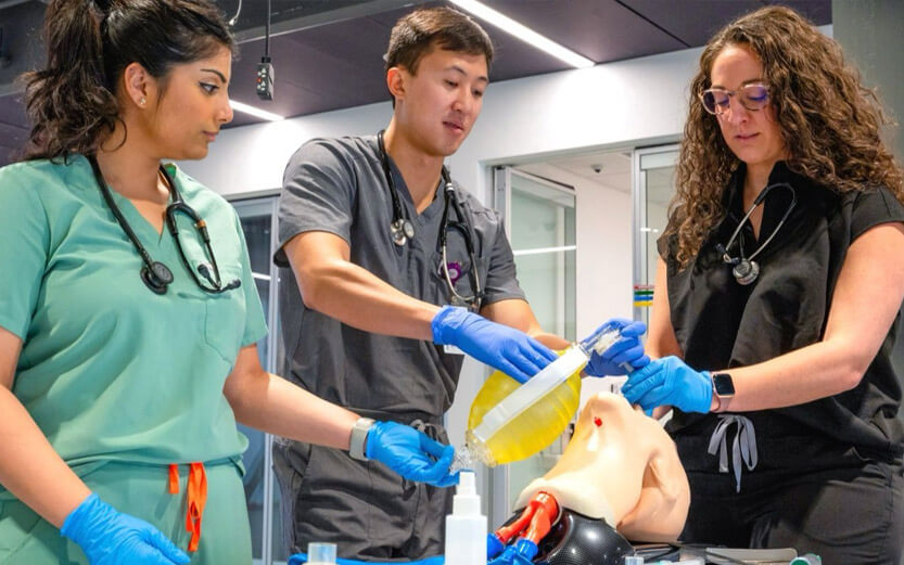 a professor demonstrating an intubation