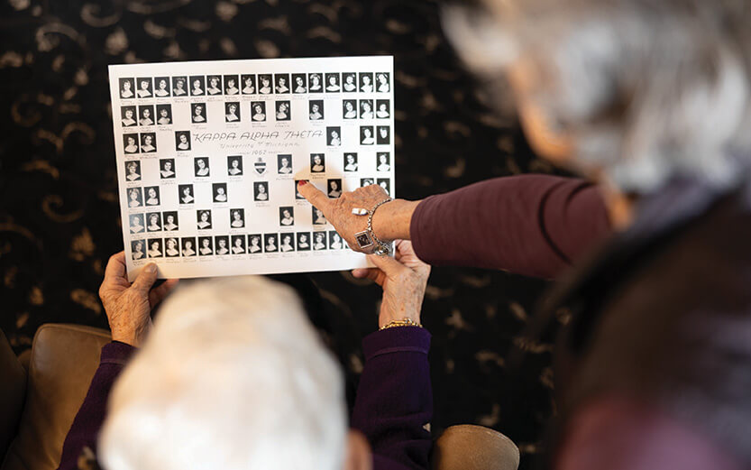 Two women looking at an older composite