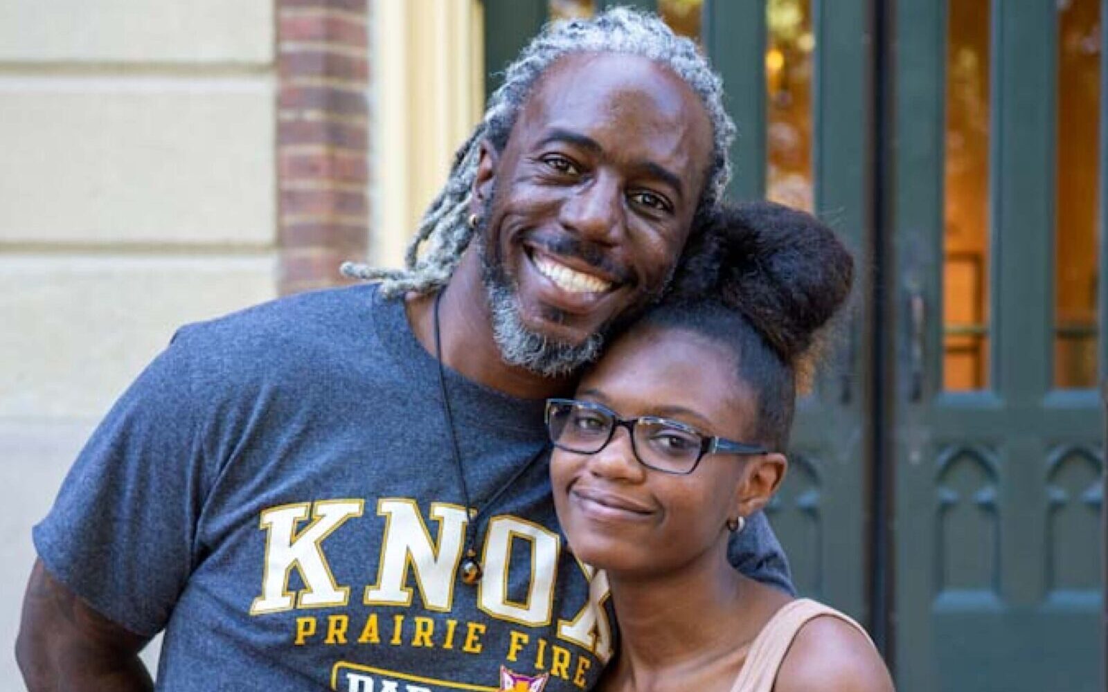 Father and daughter smiling