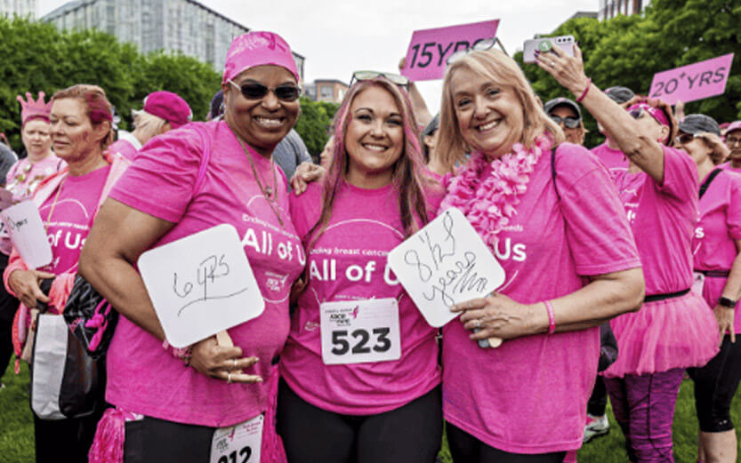 three women at a breast cancer fundraising event