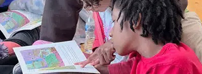 kids reading about Kentucky