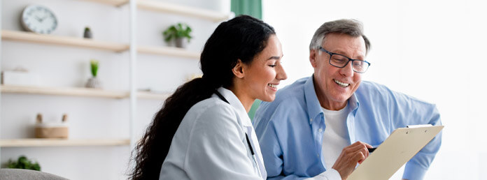 a doctor showing a patient his chart