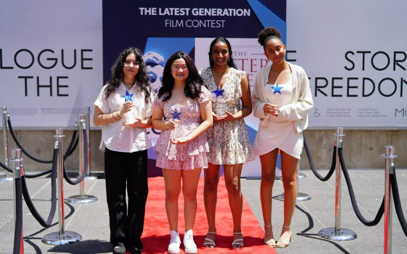 a group of four women holding trophies they won at The Latest Generation Film Contest