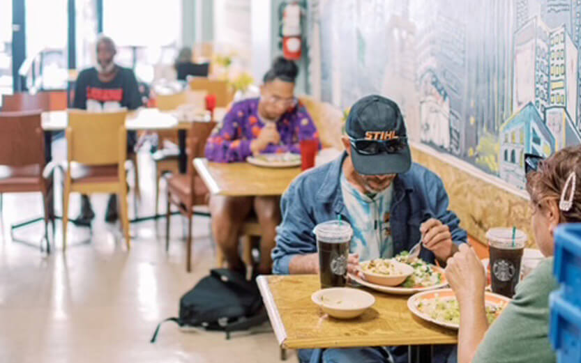 people eating at a food service facility