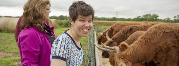 girl with cattle smiling