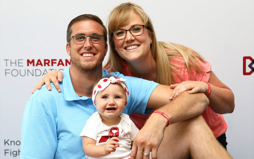 couple with baby at event
