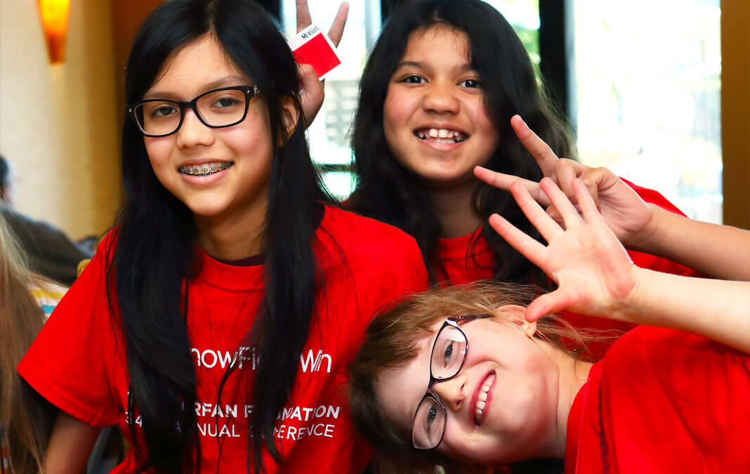 three girls in red shirts