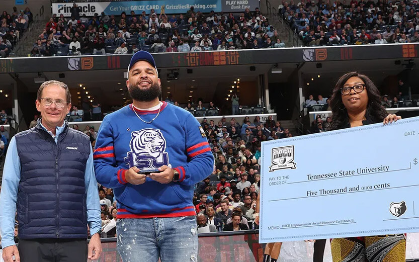 the presentation of a giant check to Tennessee State University