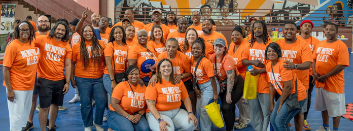 a group of Memphis Allis supporters in orange tshirts