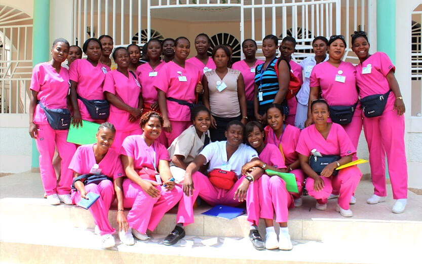 group shot of midwives in pink scrubs
