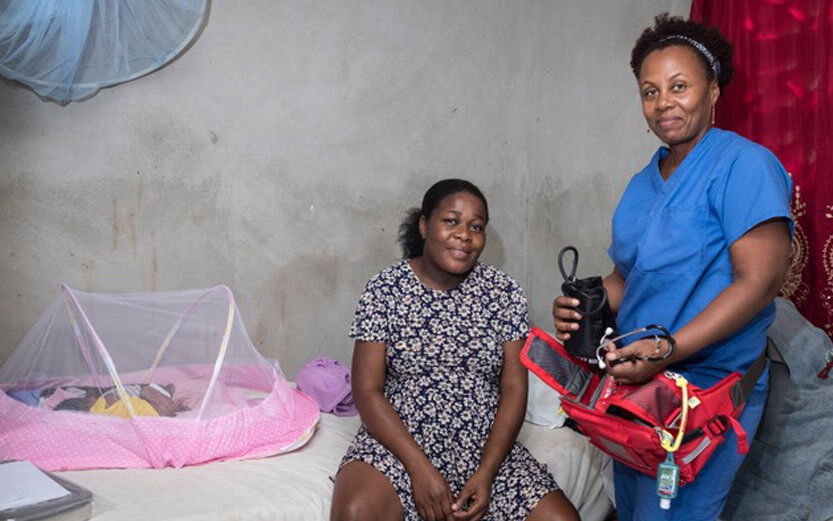 midwife checking on a new mother